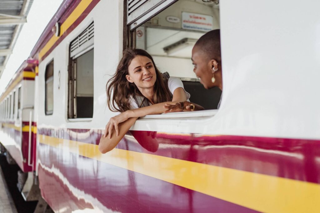 Ladies beside the window train talking to each other