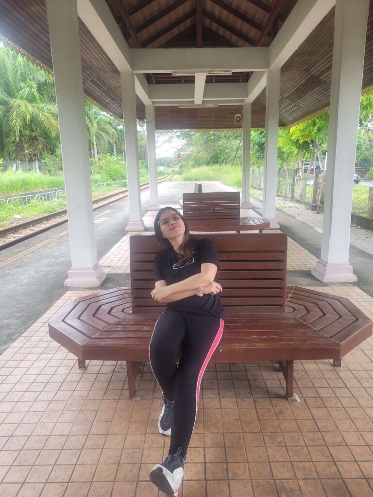 Marez sitting in one bench while at the Padang Besar Station