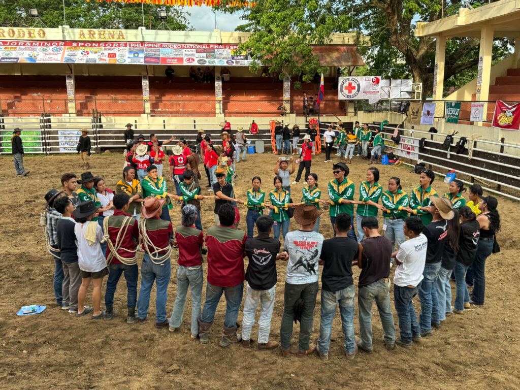 University Students holding each other hands after daily Rodeo event